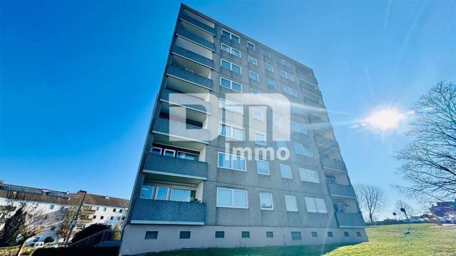 Modernisierte Eigentumswohnung mit Balkon in gepflegtem Mehrfamilienhaus - Rückansicht